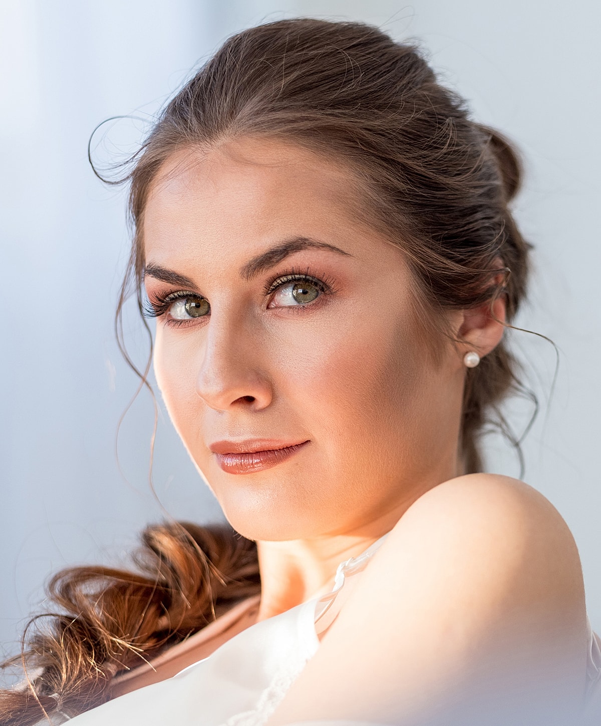 Close-up of a beautiful woman with soft lighting.