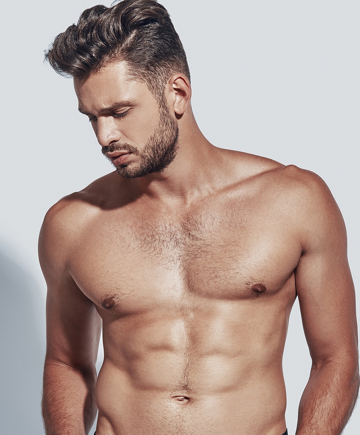 Male model posing with a focused expression.
