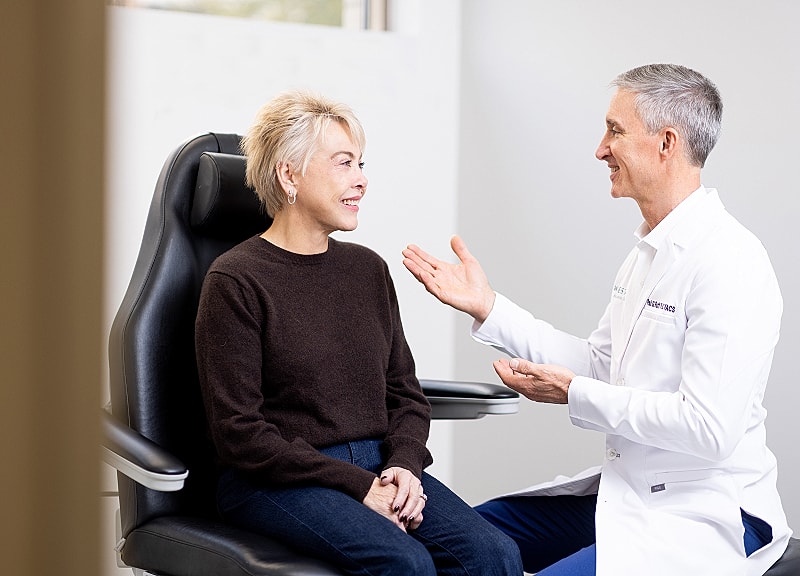 Doctor consulting with patient in modern clinic.