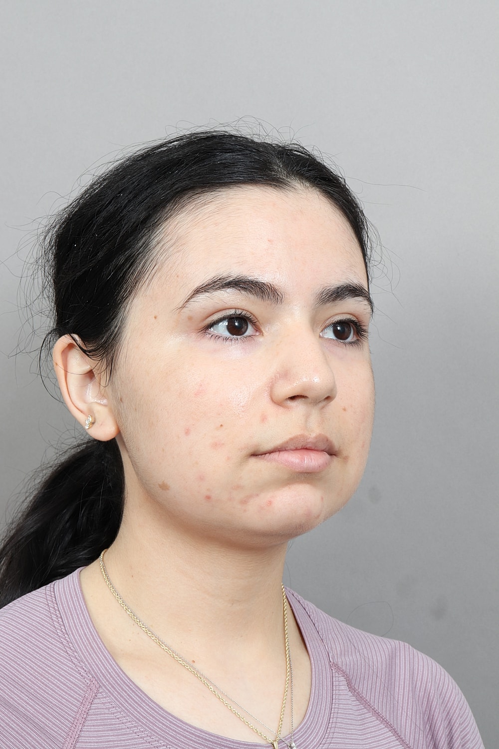 Profile view of a woman with dark hair