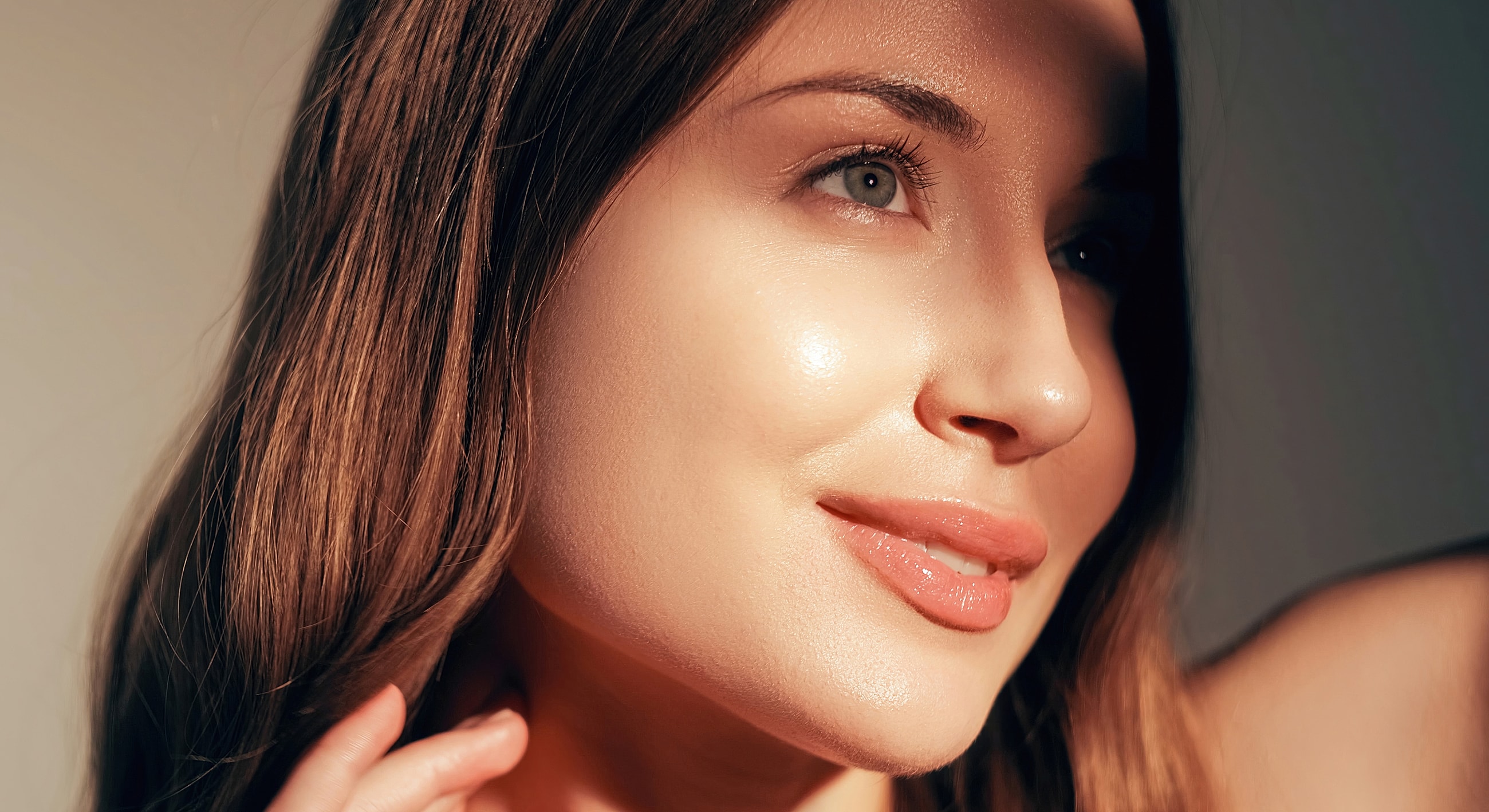 Portrait of a woman with glowing skin.