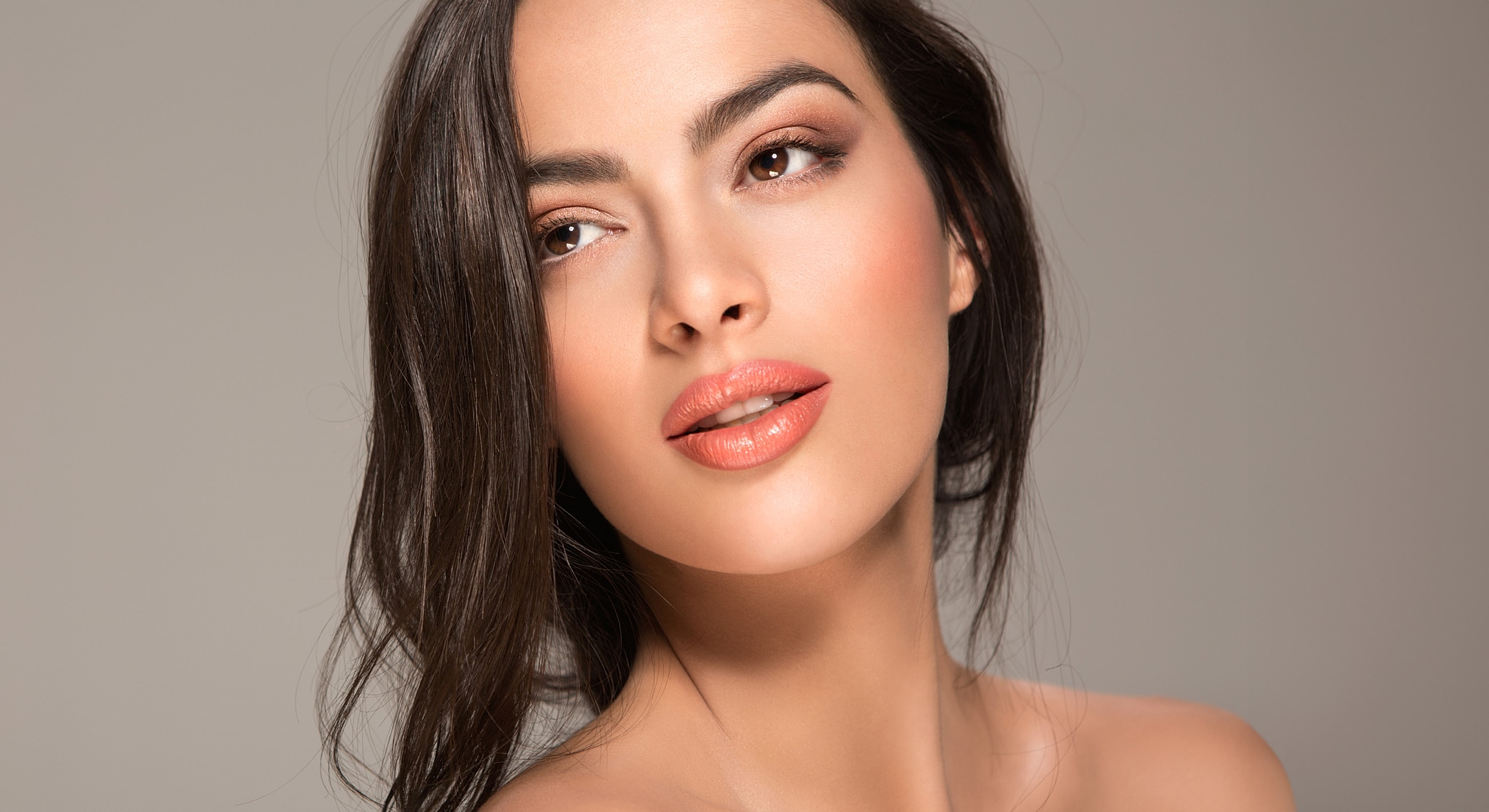 Beautiful woman with natural makeup and long hair.
